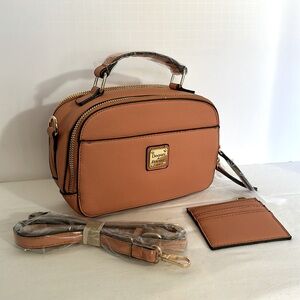 Pumpkin colored cross body purse like new. 7” wide 5” high 3” deep.